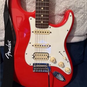 Fender Stratocaster Red Electric Guitar with White Pickguard and Black Strap